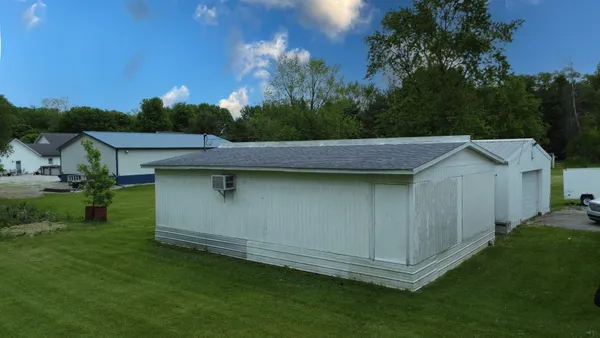 a view of a backyard with a garden
