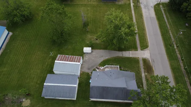 an aerial view of a house having yard