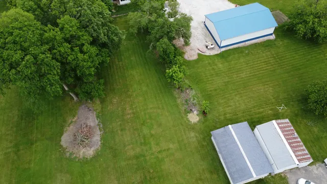 a view of a two chairs in a yard
