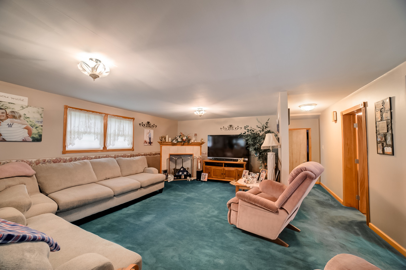 205 North Park Street Milford, IL 60953 - Photo 4 of 23 a living room with furniture fireplace and a window