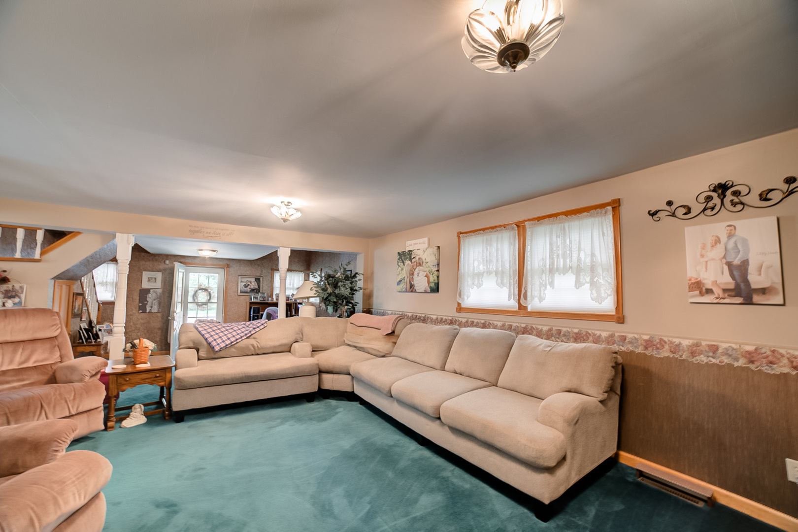 205 North Park Street Milford, IL 60953 - Photo 5 of 23 a living room with furniture and a large window