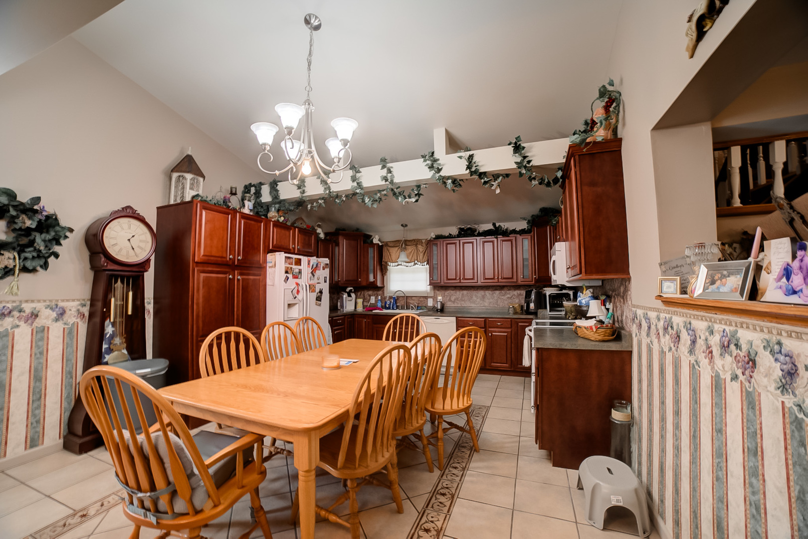 205 North Park Street Milford, IL 60953 - Photo 7 of 23 a view of a dining room with furniture and chandelier