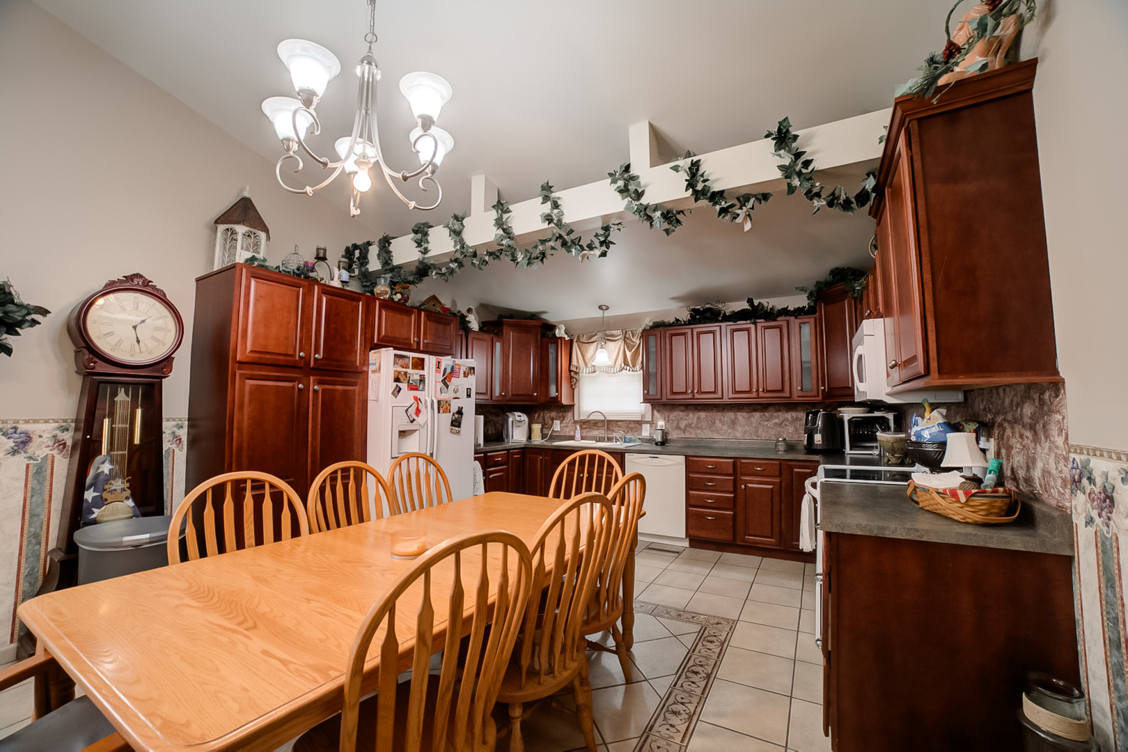 205 North Park Street Milford, IL 60953 - Photo 9 of 23 a view of a dining room with furniture and chandelier