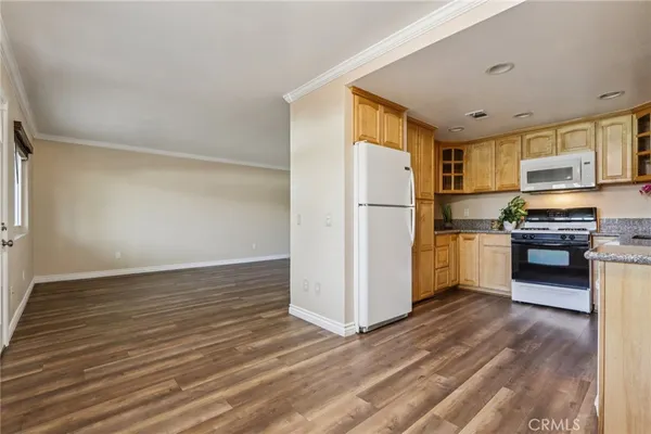 a kitchen with a refrigerator sink and stove