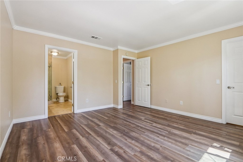 2561 Gonzaga Lane Riverside, CA 92507 - Photo 28 of 48 a view of a big room with wooden floor and a bathroom