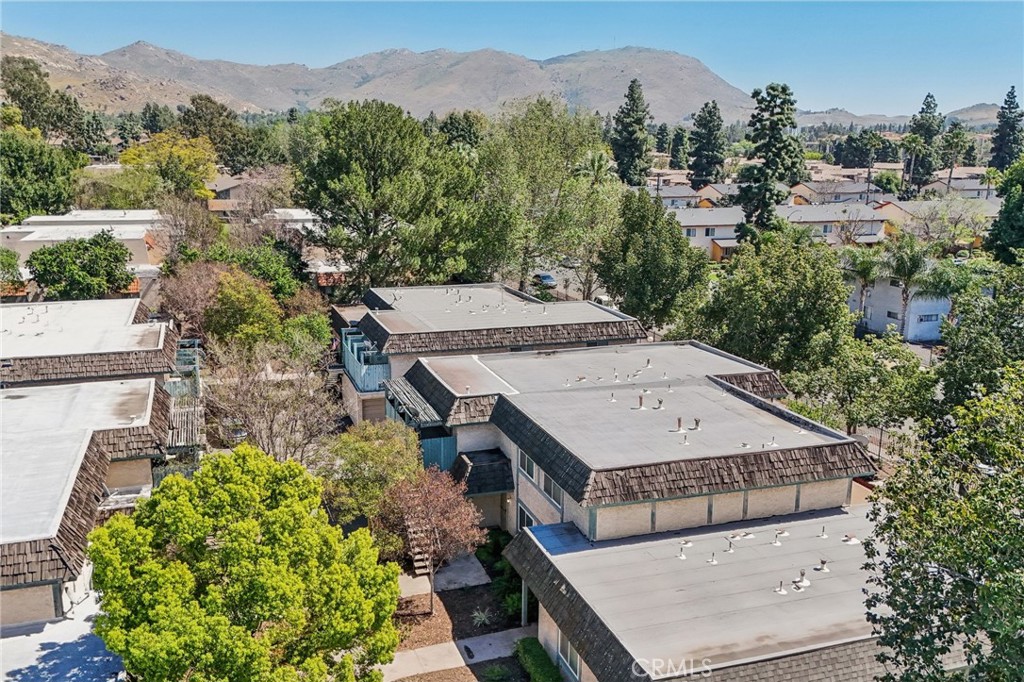 2561 Gonzaga Lane Riverside, CA 92507 - Photo 47 of 48 an aerial view of a house with a yard and mountain view in back