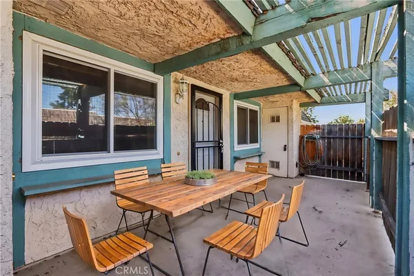 a wooden bench sitting in front of a building