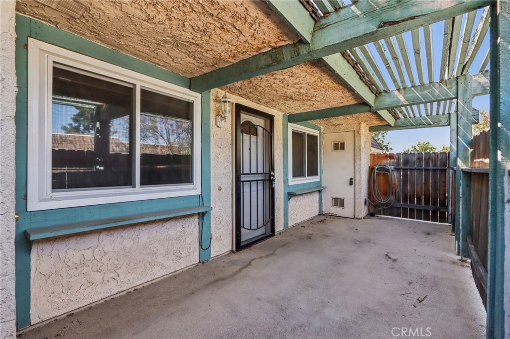 2561 Gonzaga Lane Riverside, CA 92507 - Photo 9 of 48 a view of a porch with a table and chairs