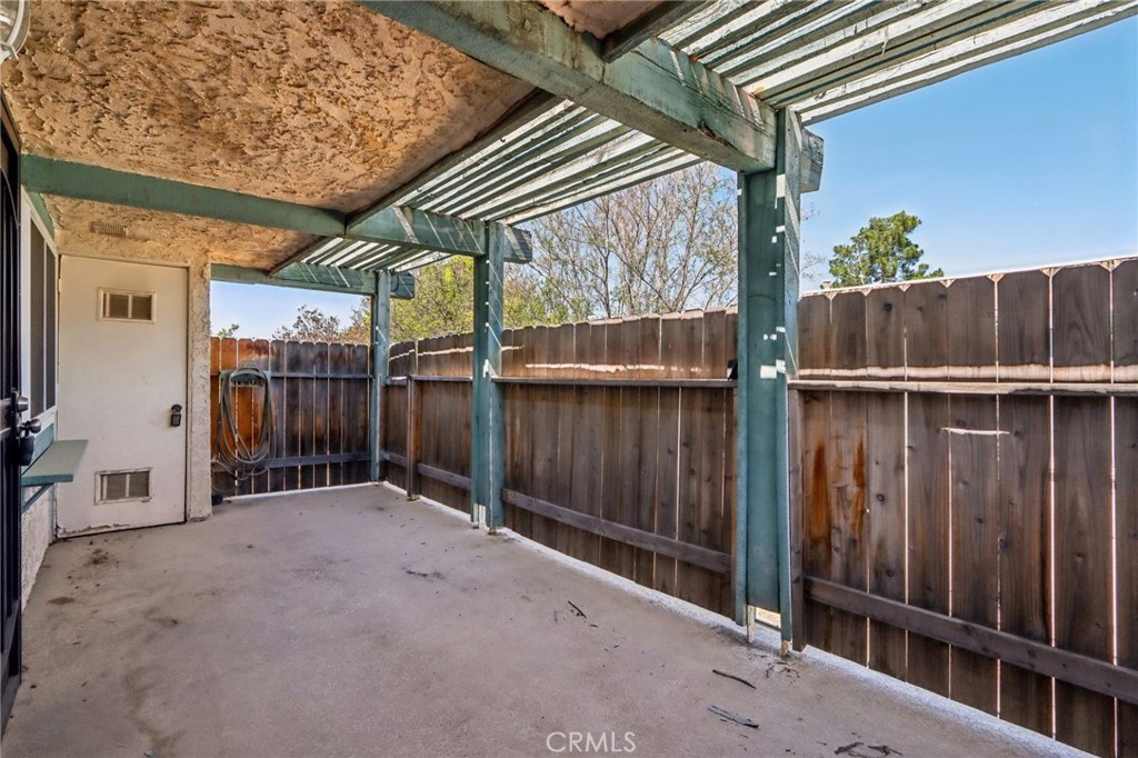 2561 Gonzaga Lane Riverside, CA 92507 - Photo 10 of 48 a view of a house with a wooden fence