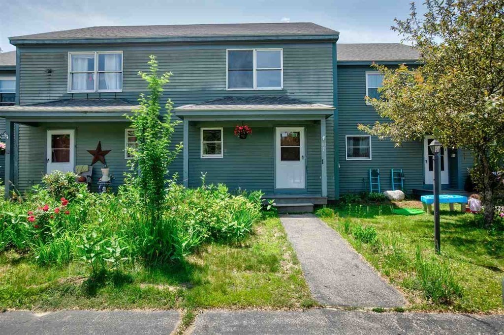 84 Union Street, Unit 84 Peterborough, NH 03458 - Photo 1 of 1 a front view of a house with garden