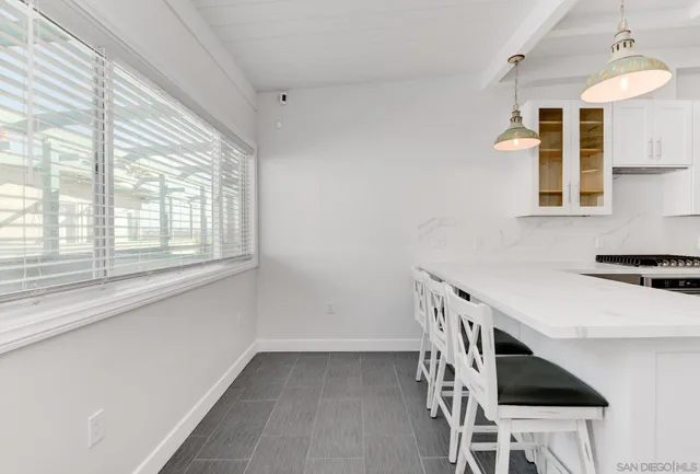 a kitchen with a stove a sink and a refrigerator