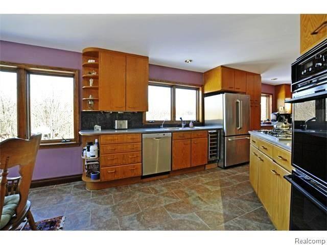 4938 Barber Road Metamora, MI 48455 - Photo 13 of 26 Oak Cabinets & SS Appliances.jpg