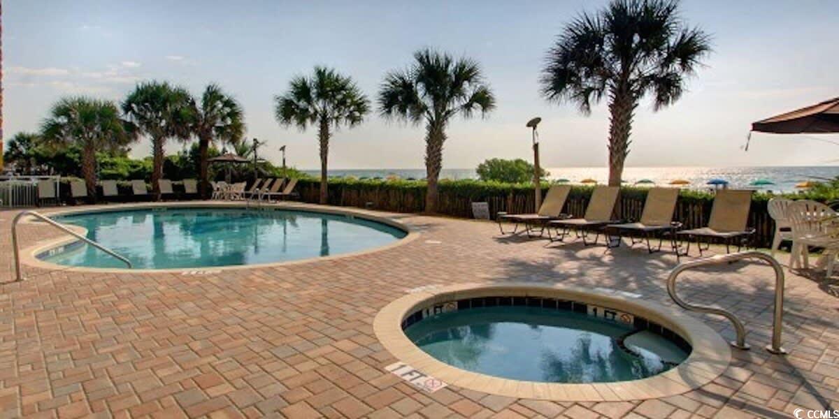 2504 North Ocean Boulevard, Unit 1234 Myrtle Beach, SC 29577 - Photo 16 of 22 Community pool featuring a patio and a hot tub