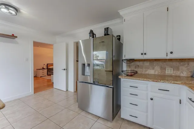 a view of cabinets and wooden floor