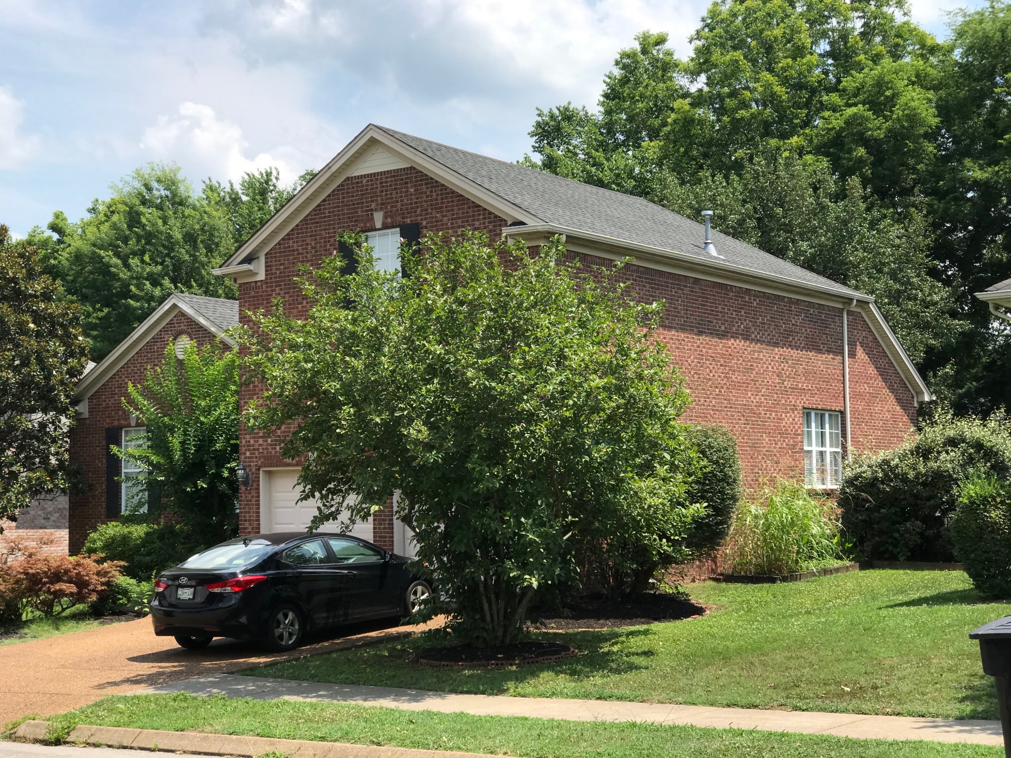 330 Astor Way Franklin, TN 37064 - Photo 2 of 17 a front view of a house with garden