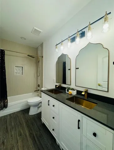 a view of a room with wooden floor