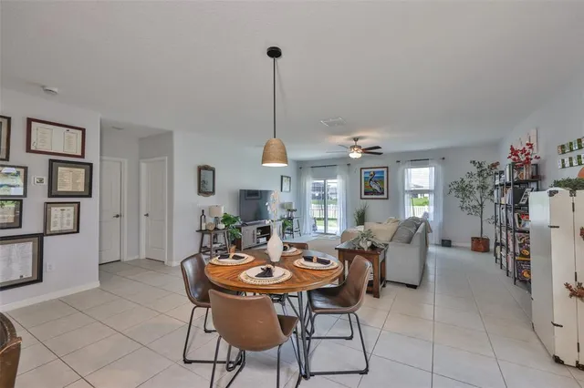 a view of a dining room and livingroom furniture window and outside view