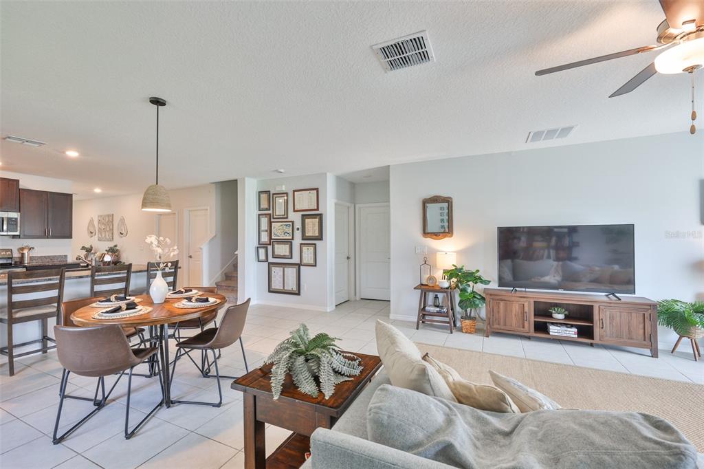 12746 Weston Oaks Lane Riverview, FL 33579 - Photo 18 of 56 a living room with furniture and a flat screen tv
