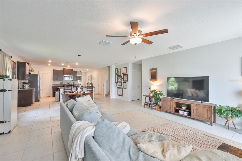 12746 Weston Oaks Lane Riverview, FL 33579 - Photo 20 of 56 a living room with furniture and a flat screen tv