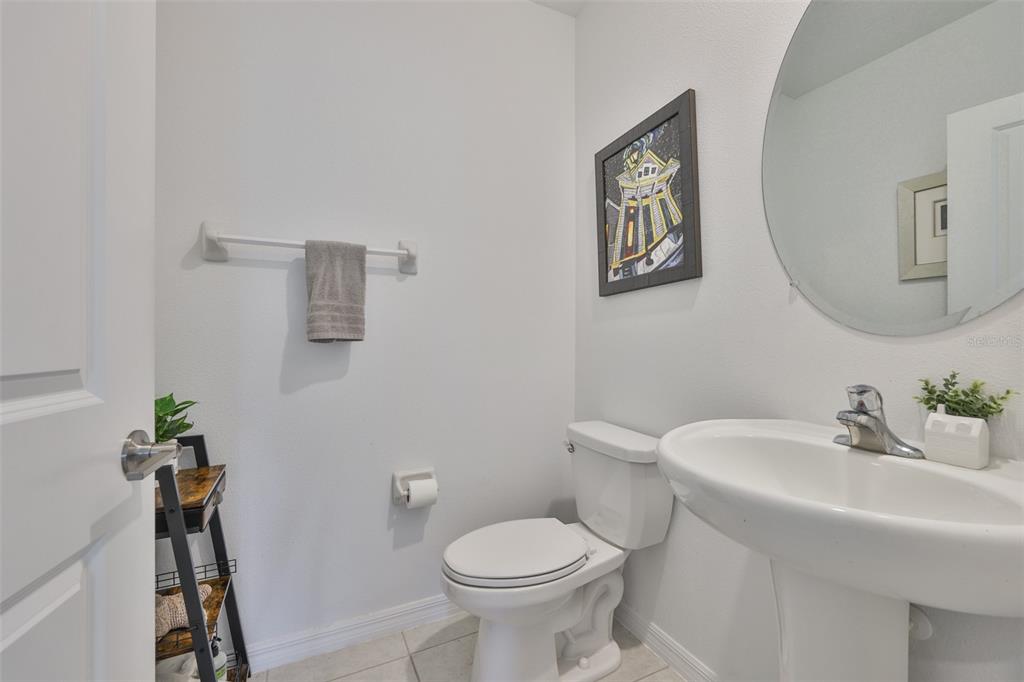 12746 Weston Oaks Lane Riverview, FL 33579 - Photo 21 of 56 a bathroom with a toilet sink and mirror