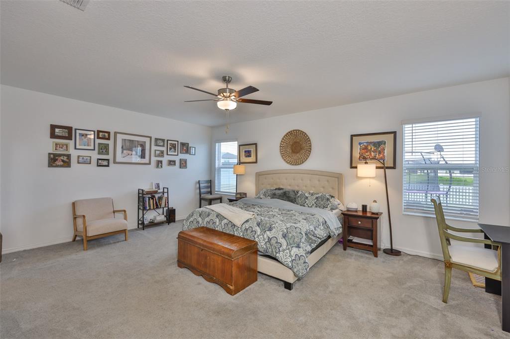 12746 Weston Oaks Lane Riverview, FL 33579 - Photo 22 of 56 a spacious bedroom with a bed and furniture
