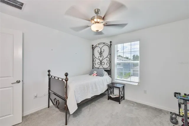 a view of workspace with a window and ceiling fan