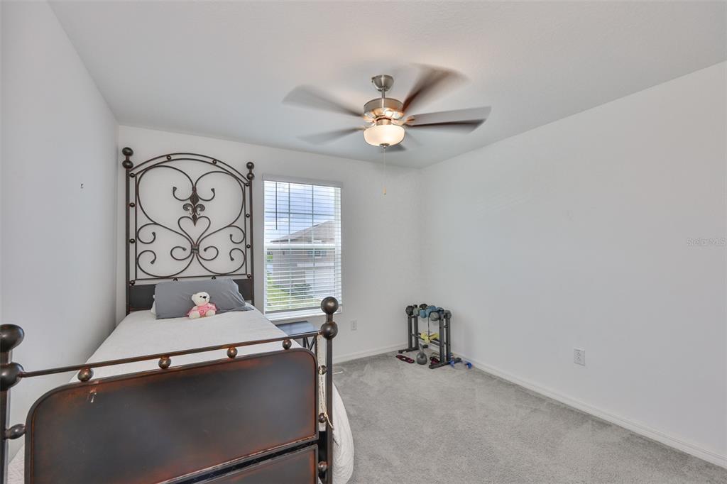 12746 Weston Oaks Lane Riverview, FL 33579 - Photo 34 of 56 a view of workspace with a window and ceiling fan
