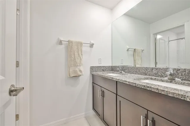 a bathroom with a shower curtain a bathtub and a shower