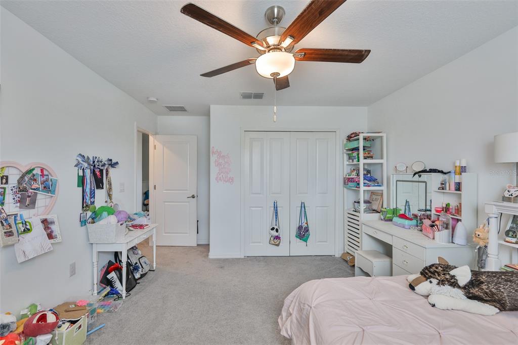 12746 Weston Oaks Lane Riverview, FL 33579 - Photo 40 of 56 a bedroom with a bed and a window