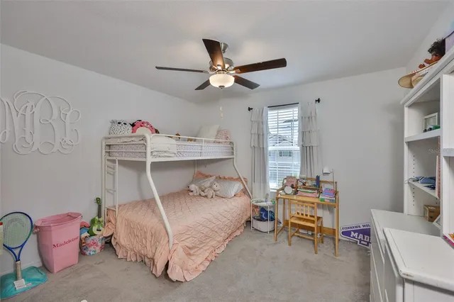 a bedroom with a bed and cabinets