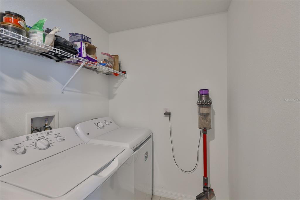 12746 Weston Oaks Lane Riverview, FL 33579 - Photo 43 of 56 a utility room with dryer and washer