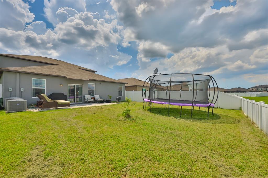 12746 Weston Oaks Lane Riverview, FL 33579 - Photo 47 of 56 a swimming pool with outdoor seating and yard