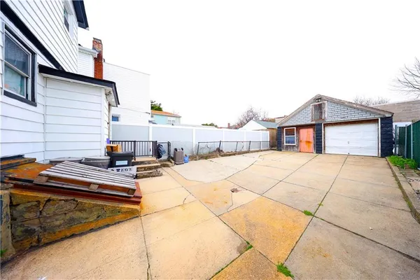 a view of a backyard with sitting area