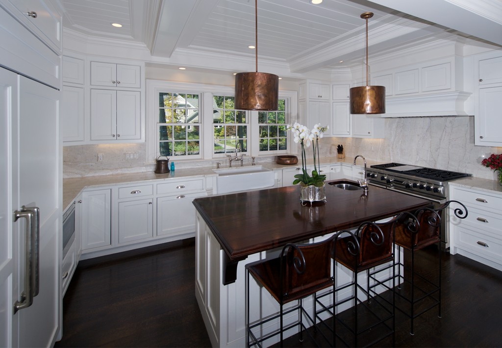 44 Valley Road Wellesley, MA 02481 - Photo 12 of 30 a kitchen with stainless steel appliances granite countertop a sink a stove a refrigerator a dining table and chairs