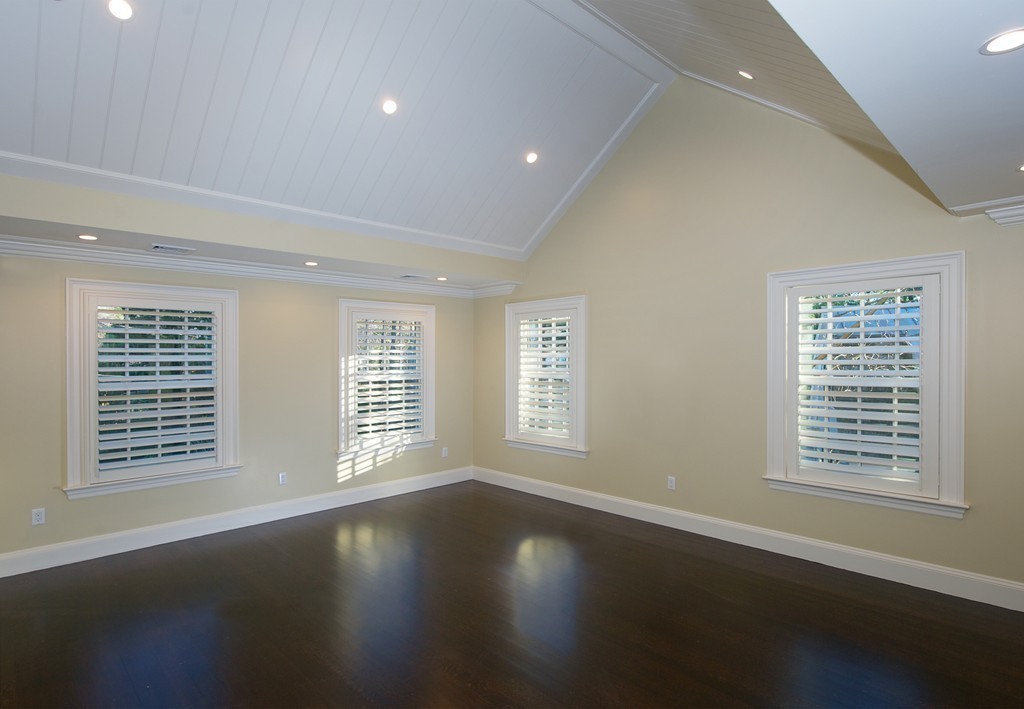 44 Valley Road Wellesley, MA 02481 - Photo 17 of 30 a view of an empty room with wooden floor and a window
