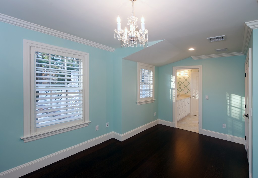 44 Valley Road Wellesley, MA 02481 - Photo 21 of 30 a view of a room with wooden floor and a chandelier