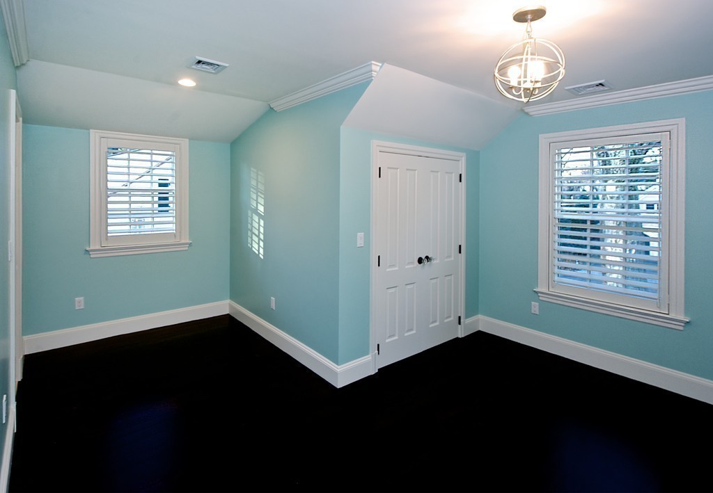 44 Valley Road Wellesley, MA 02481 - Photo 22 of 30 a view of an empty room with wooden floor and a window