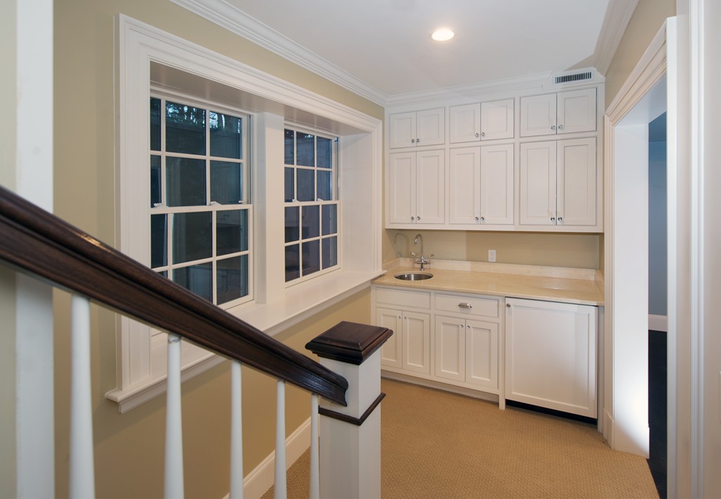 44 Valley Road Wellesley, MA 02481 - Photo 25 of 30 a kitchen with granite countertop white cabinets and sink