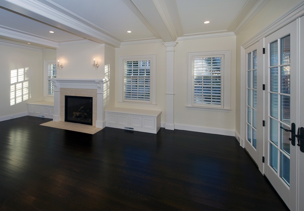 44 Valley Road Wellesley, MA 02481 - Photo 3 of 30 an empty room with wooden floor fireplace and windows