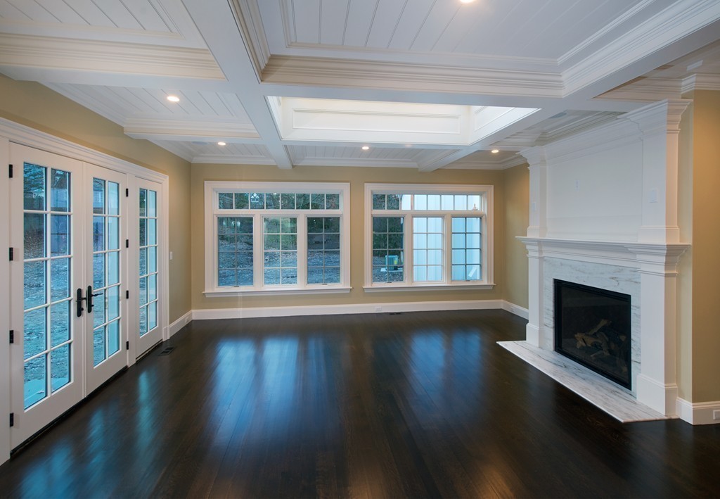 44 Valley Road Wellesley, MA 02481 - Photo 7 of 30 a view of an empty room with wooden floor and a window
