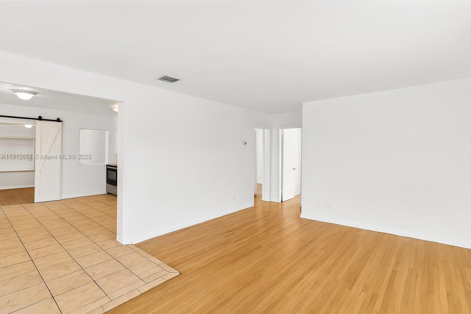 3415 Southwest 15th Street, Unit 2 Miami, FL 33145 - Photo 2 of 11 a view of empty room with wooden floor