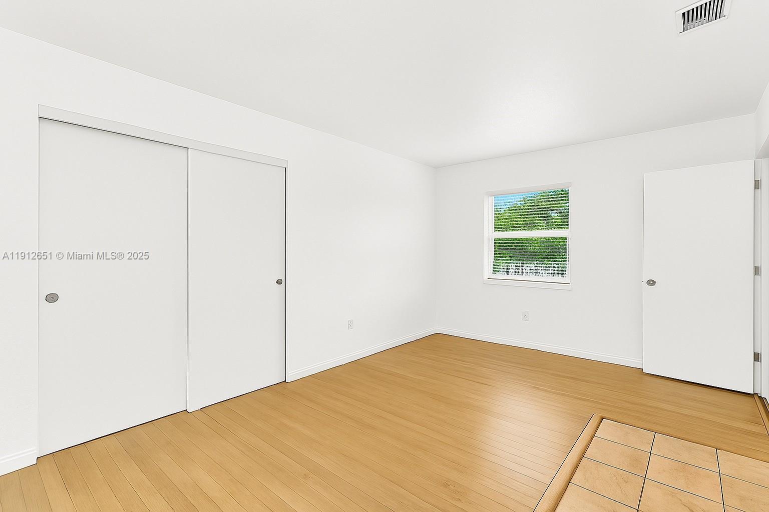 3415 Southwest 15th Street, Unit 2 Miami, FL 33145 - Photo 8 of 11 an empty room with windows