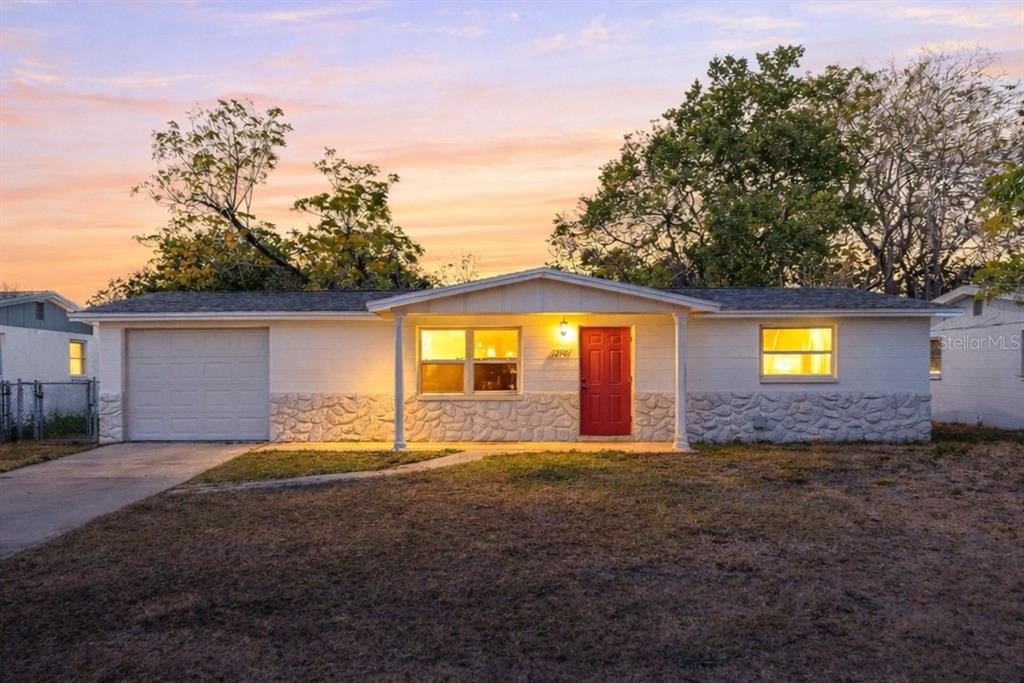 a view of a backyard of the house