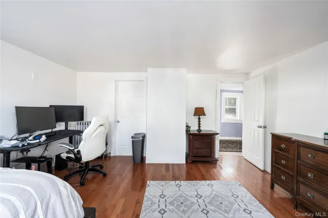 a view of a livingroom with workspace and a couch