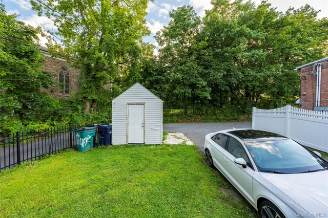 a view of backyard with trampoline
