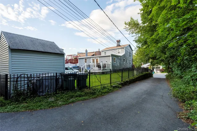 a view of a house with a street