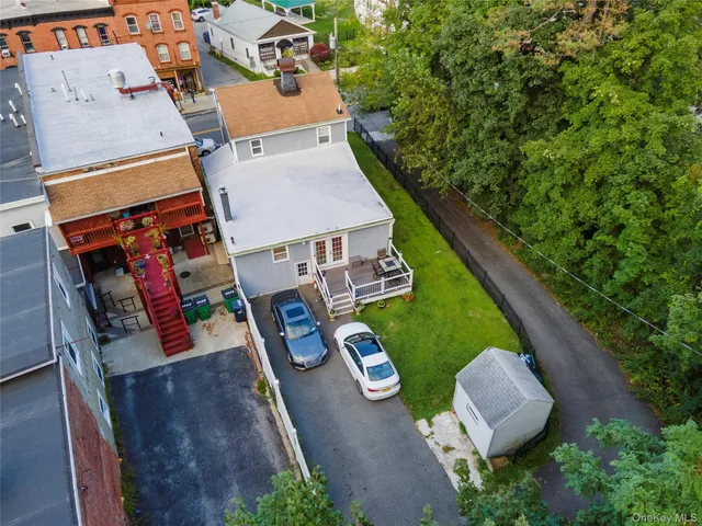 an aerial view of a house with outdoor space