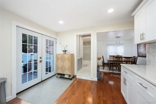 a view of living room with furniture and wooden floor