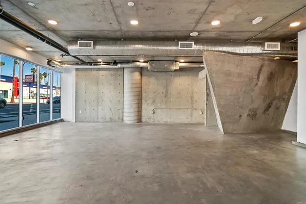 a view of empty room with wooden ceiling