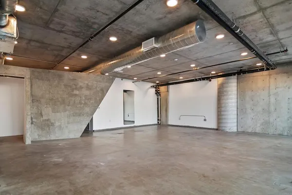 a view of a room with lots of furniture and a projector
